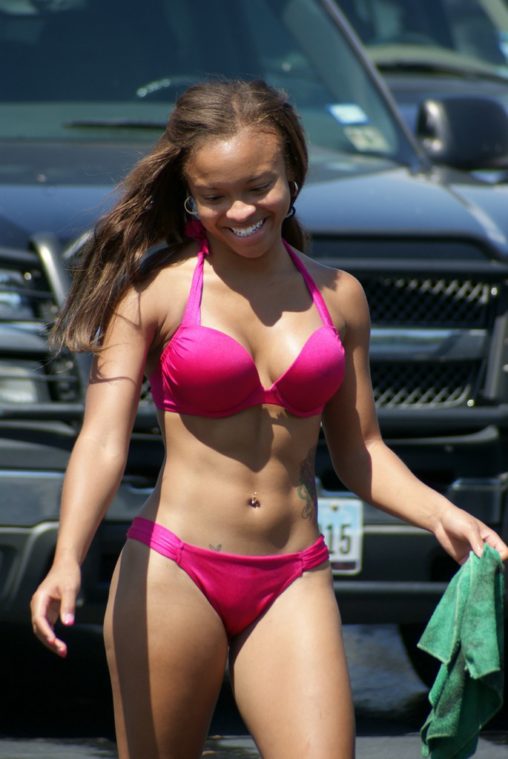 Smiling Beauty in Bikini at Car Wash