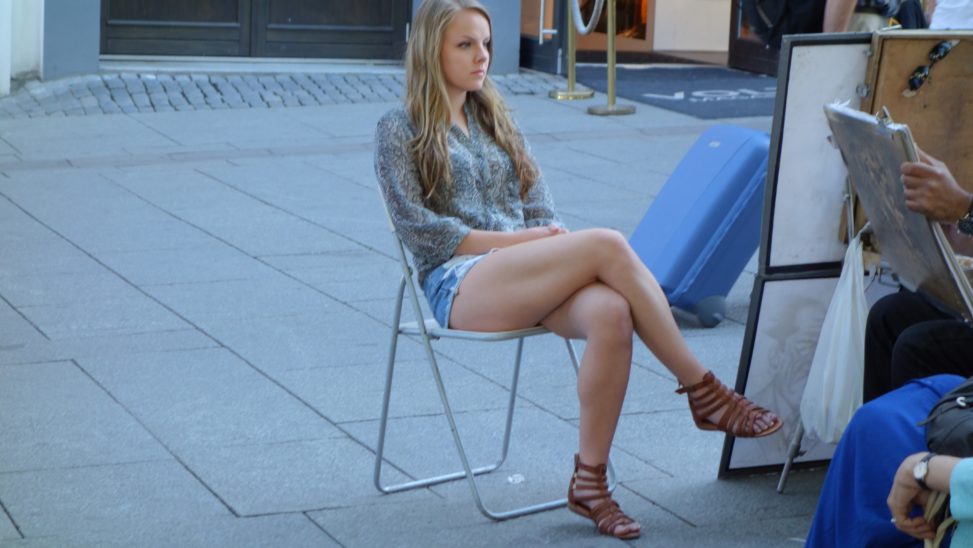 Cute Blonde in Shorts with Legs Crossed