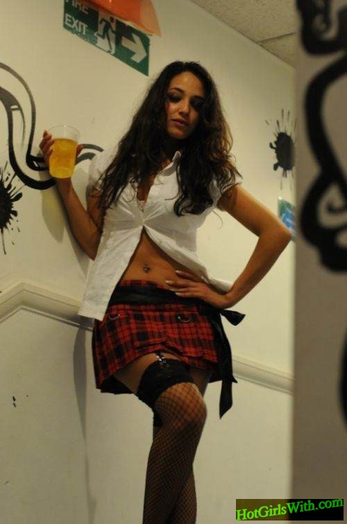 Girl in Slutty Schoolgirl Outfit with Beer